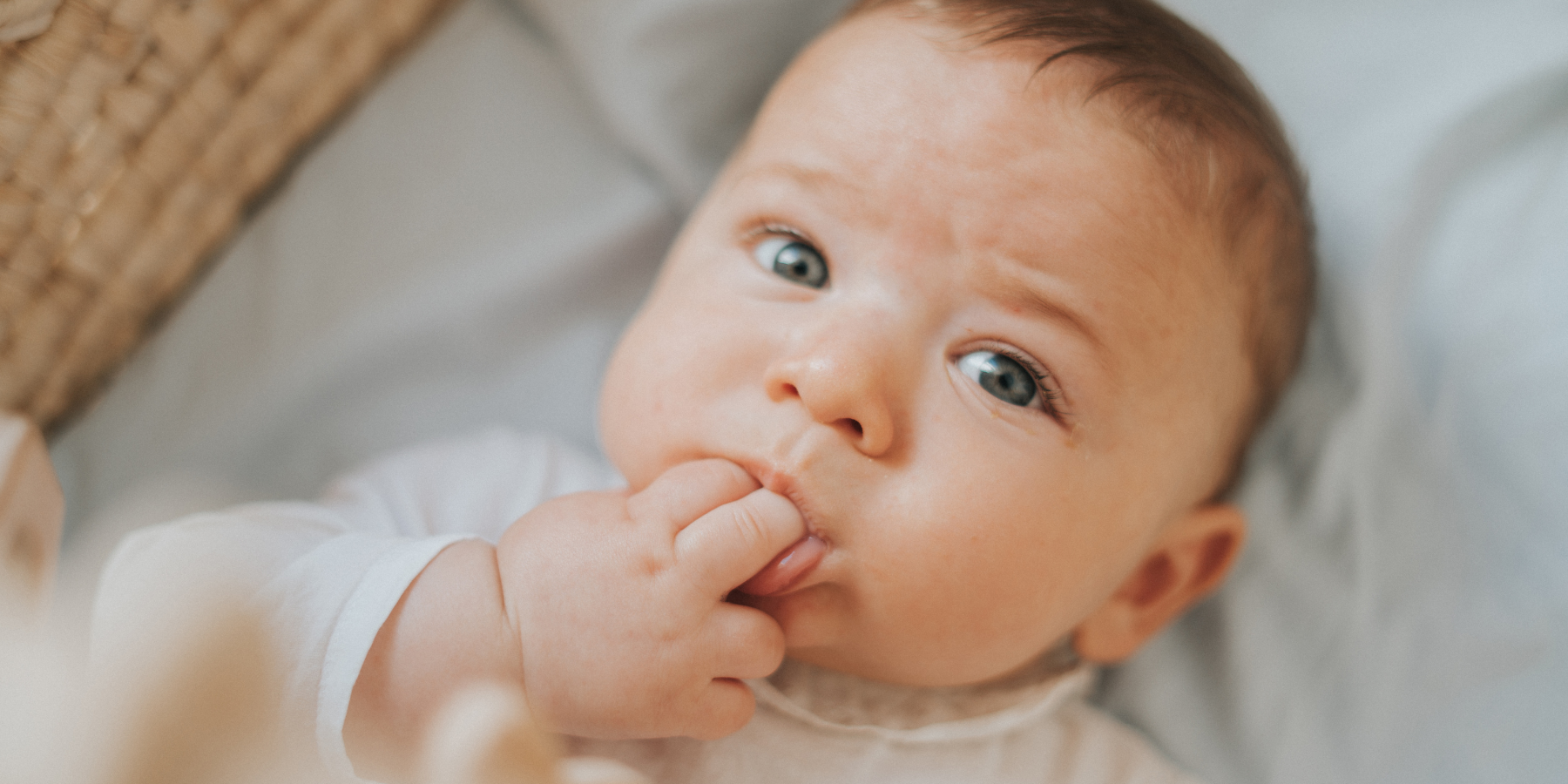 Why does my baby chew on their hands?