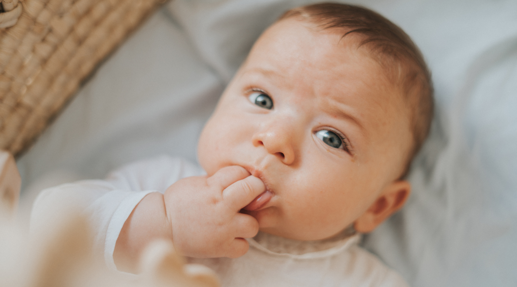 Why does my baby chew on their hands?