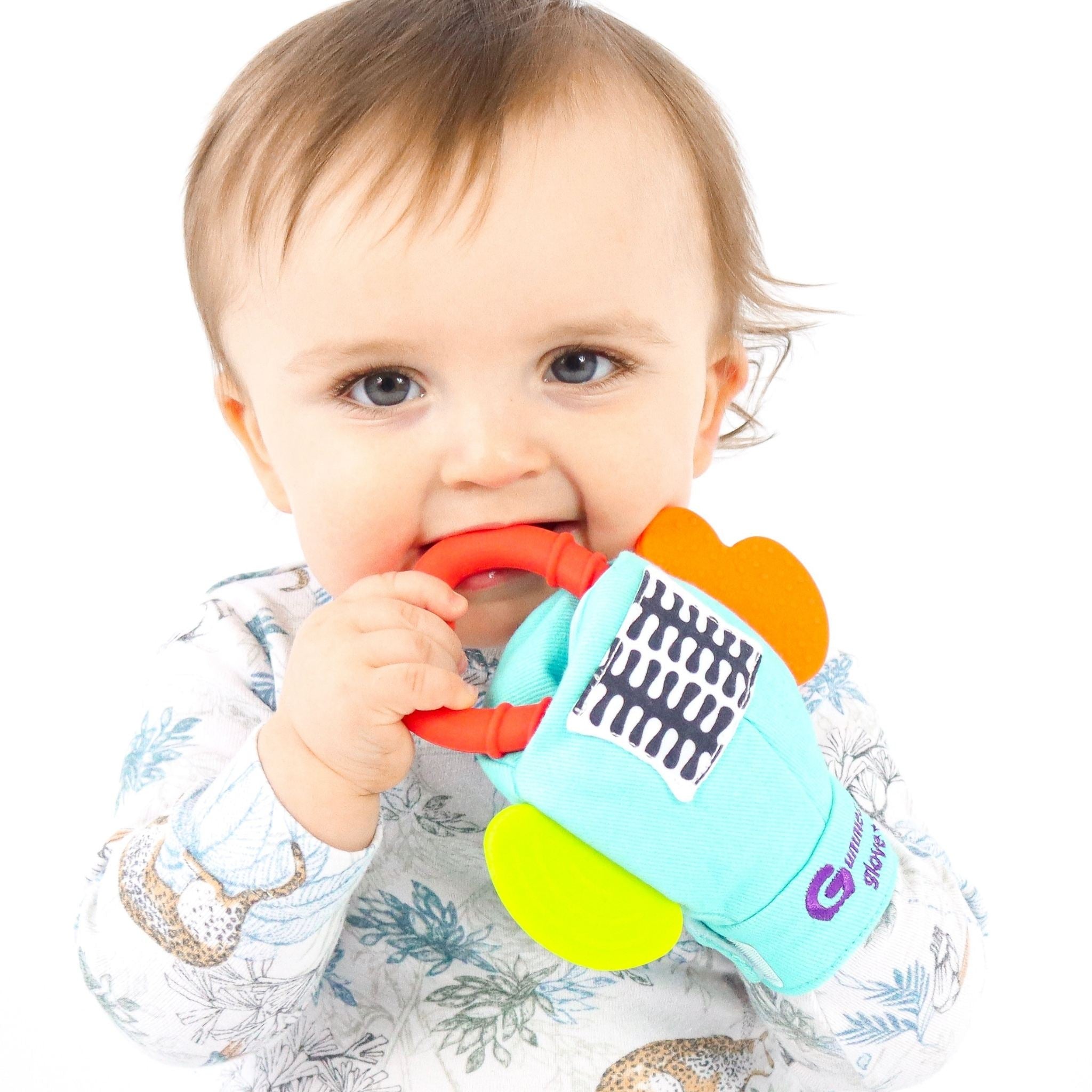 baby using gummee glove plus