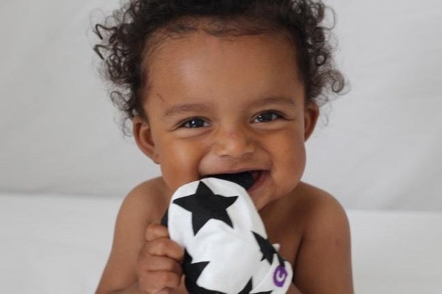 gummee glove teething mitten for babies teething ring set with silicone baby teether Black and White in use