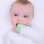 Baby chewing on their built in foldable teething mitts