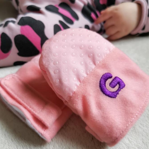 Gummee mitts with silicone dots for massaging gums